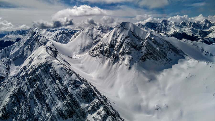 Canmore: 25-Minute Three Sisters Helicopter Tour - Taking off over the Bow River toward the Three Sisters