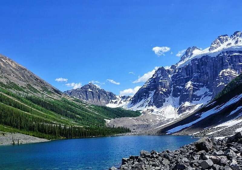 From Banff: Louise & Moraine Lake Guided Hiking Day Trip - Consolation Lakes picnic lunch under Quadra Glacier views